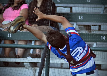 Prep Baseball Photo: Snag against the backstop